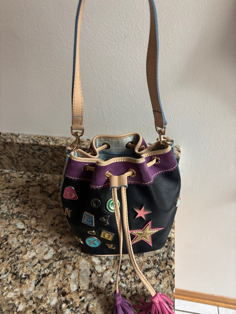 Black Leather Drawstring Bucket Bag with Purple Trim